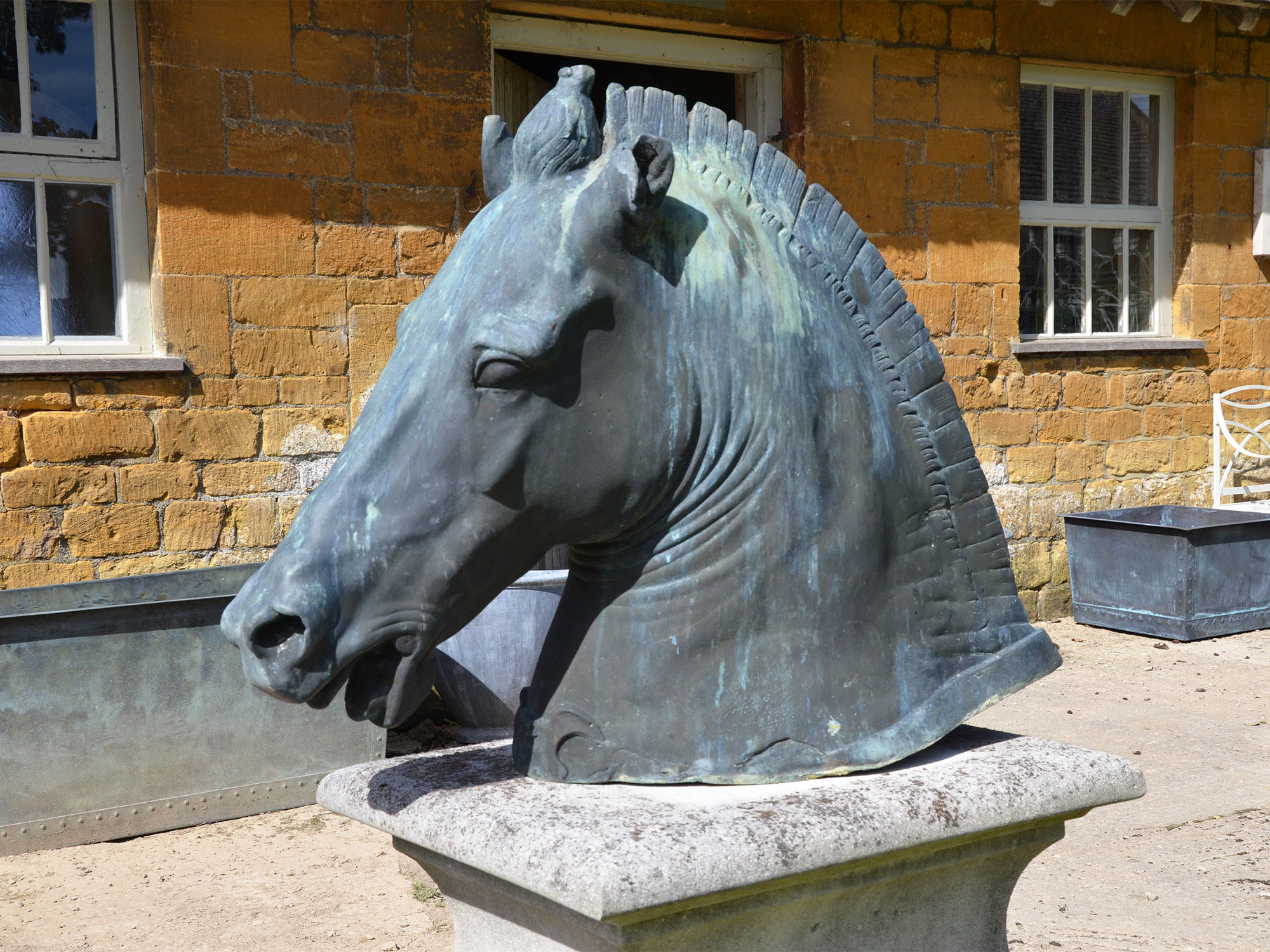 A verdigris cast bronze copy of the Roman horse head known as the